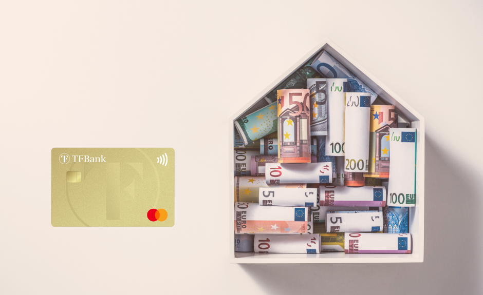 Links ist die TF Mastercard Gold abgebildet. Rechts sieht man ein Modelhaus mit Geldscheinen drin.